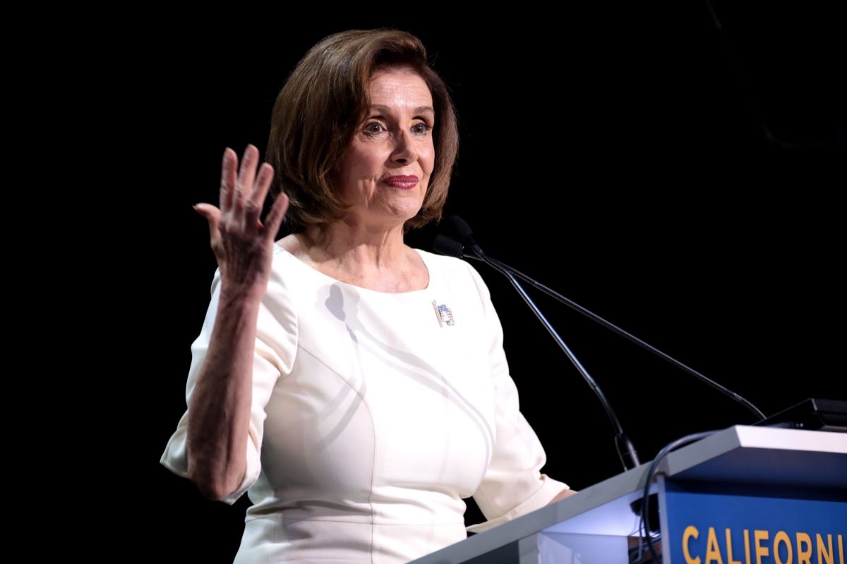 Nancy Pelosi speaking at a podium during an event
